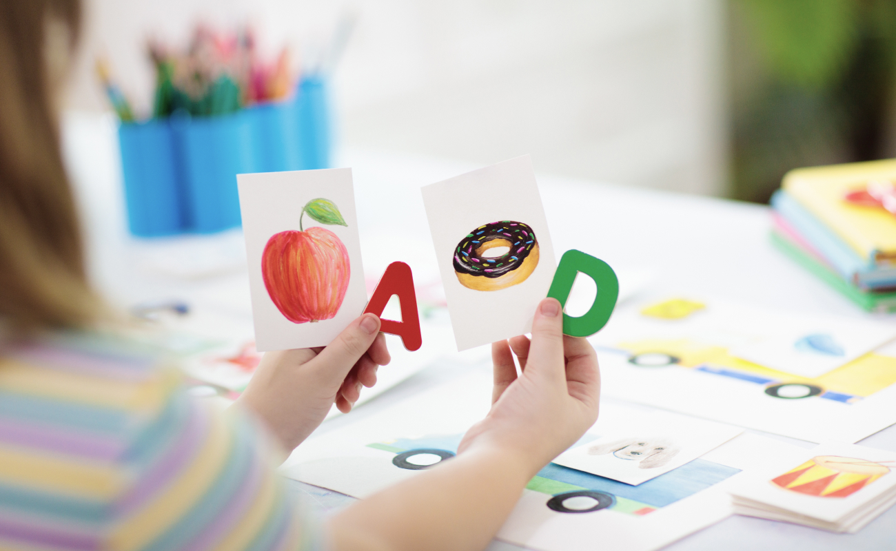 A sample curriculum kit from Amplify Desmos Math for Grade 5, featuring various educational resources like books, sound cards, and digital tools, displayed in an organized layout.