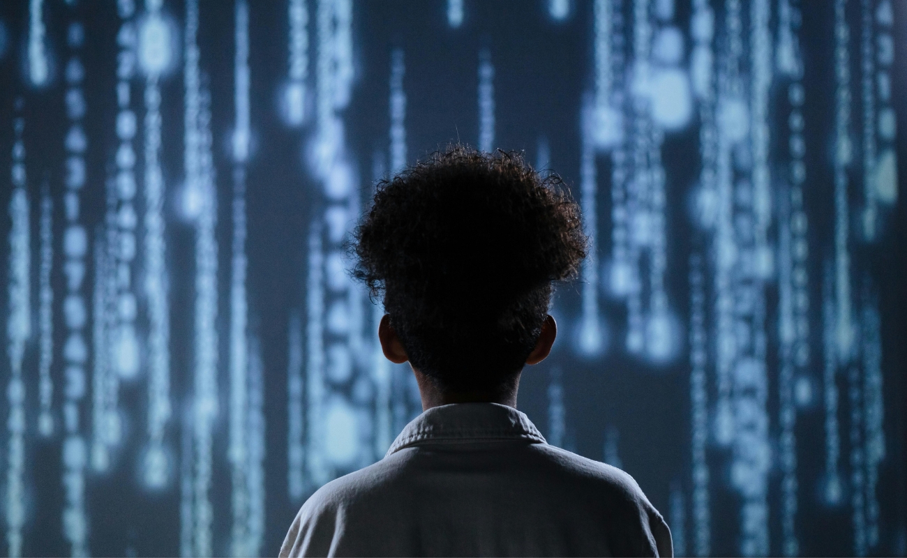 Person Looking at Digital Data Wall – AI Innovation and Creative Technology