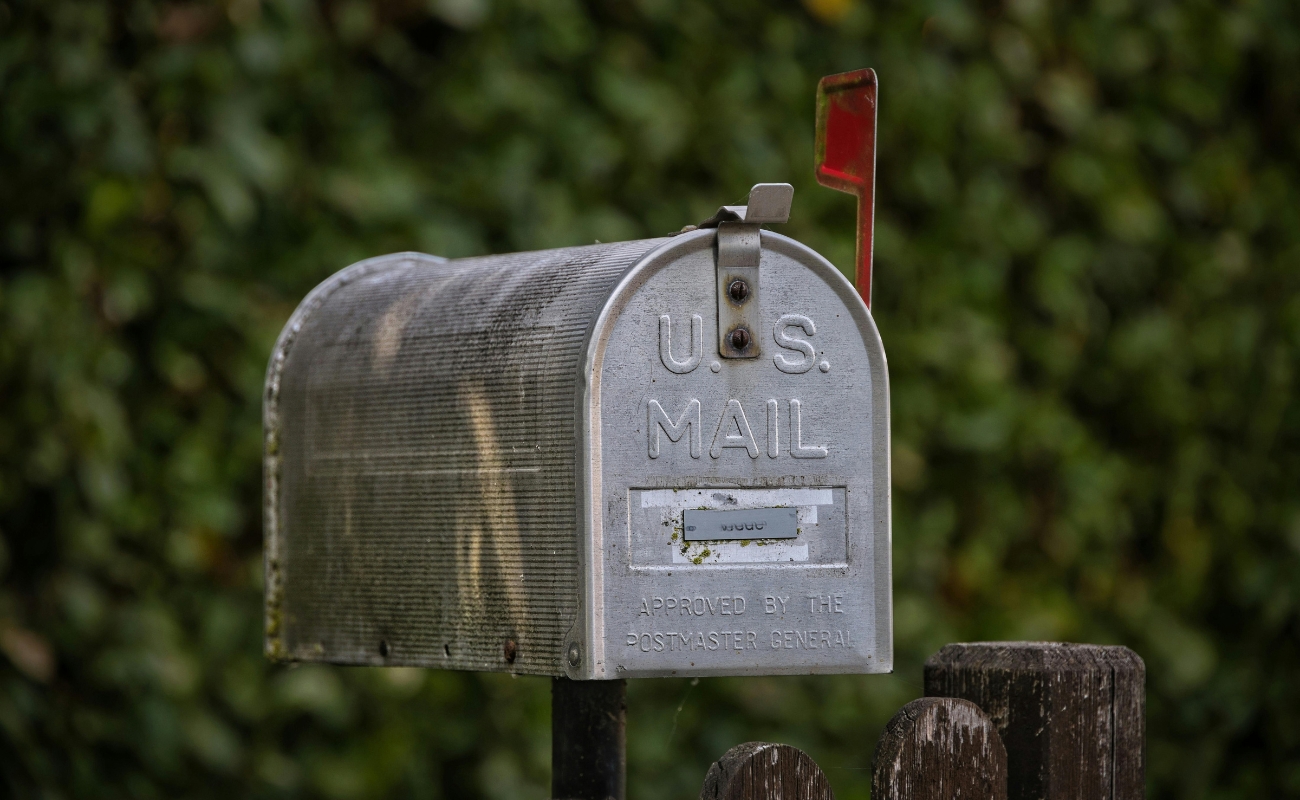 Traditional U.S. mailbox symbolizing direct mail marketing strategy, USPS rate increases, and 2027 postal campaign planning.