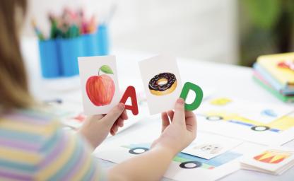 A sample curriculum kit from Amplify Desmos Math for Grade 5, featuring various educational resources like books, sound cards, and digital tools, displayed in an organized layout.