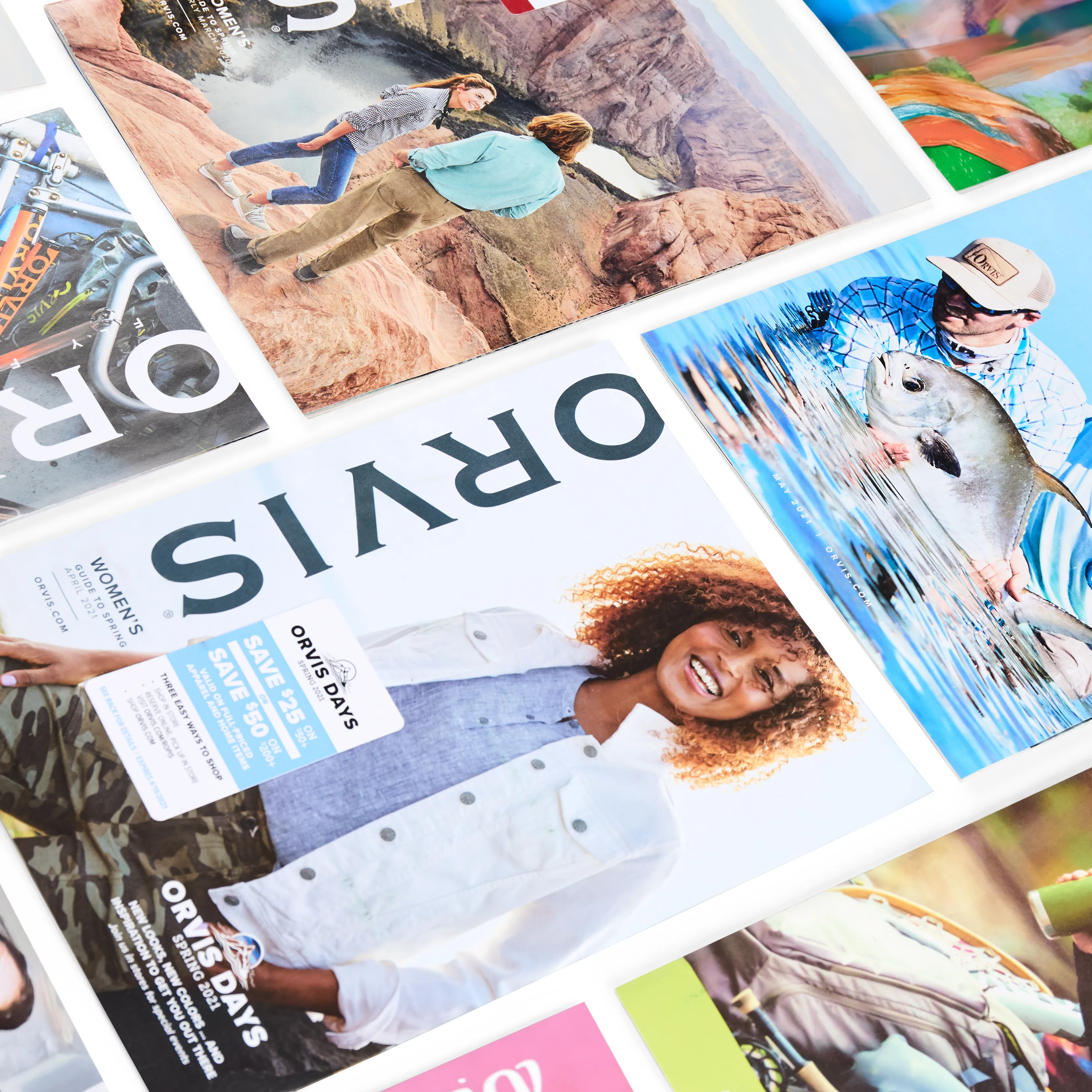 Stack of colorful printed magazines and marketing materials