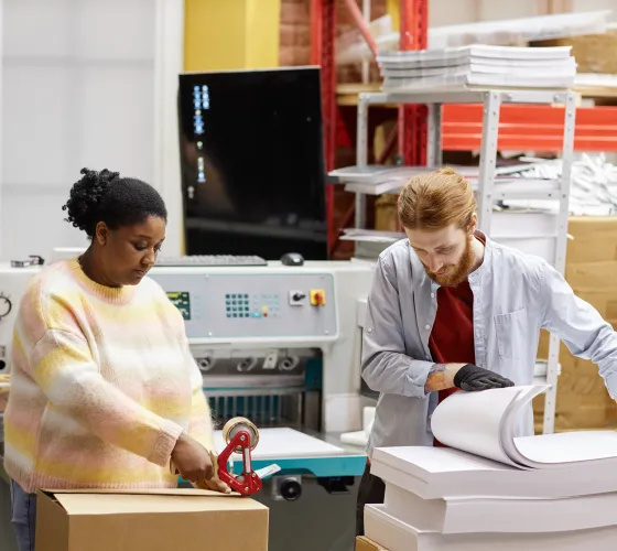 Workers doing quality control at printing factory